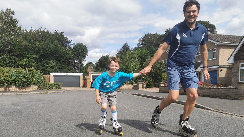 Dylan Almond and his father Darren skating