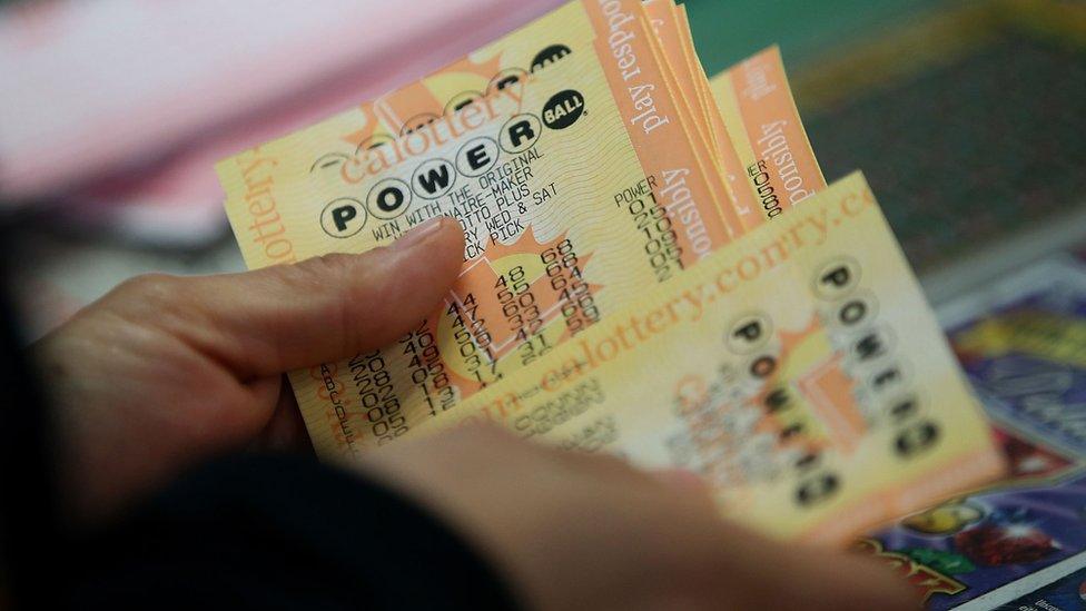 A customer buys Powerball tickets at Kavanagh Liquors on 13 January 2016 in San Lorenzo, California