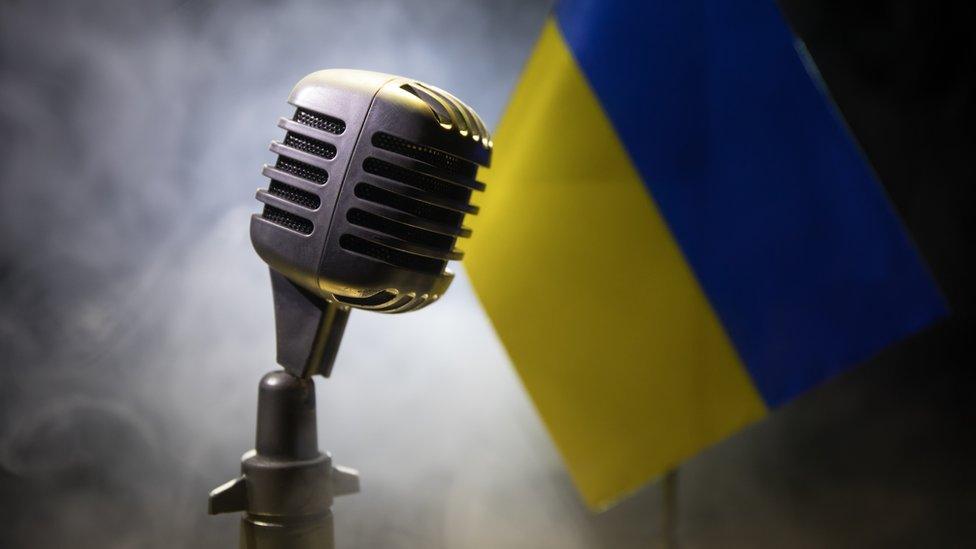 microphone and Ukraine flag