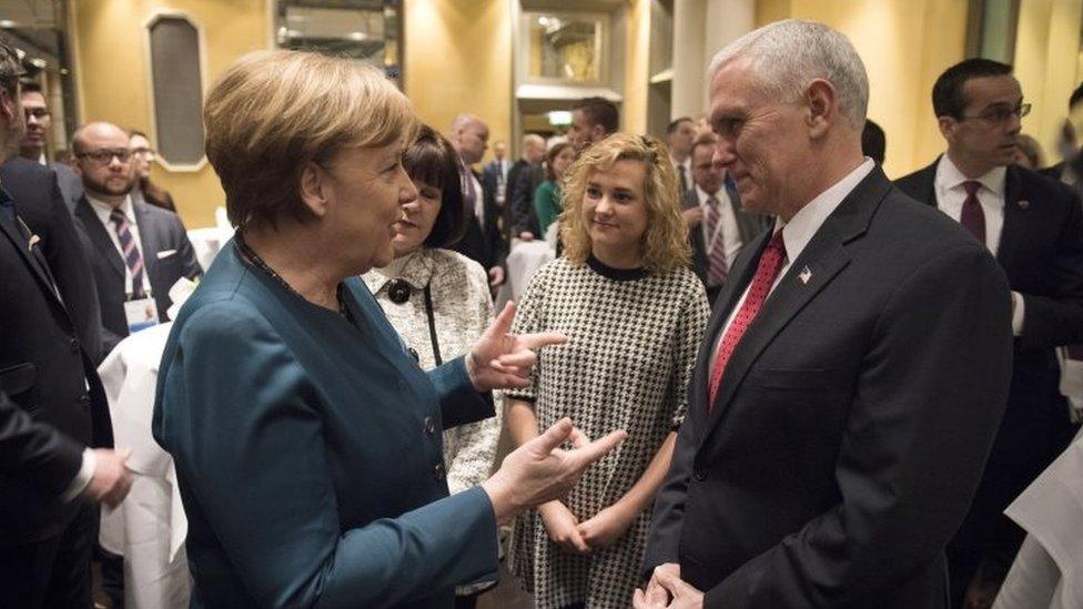 Angela Merkel and Mike Pence talking informally at the Munich Security Conference, 18 February 2017