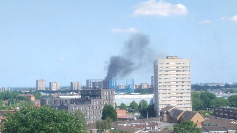 Plume of smoke as high as a nearby tower block