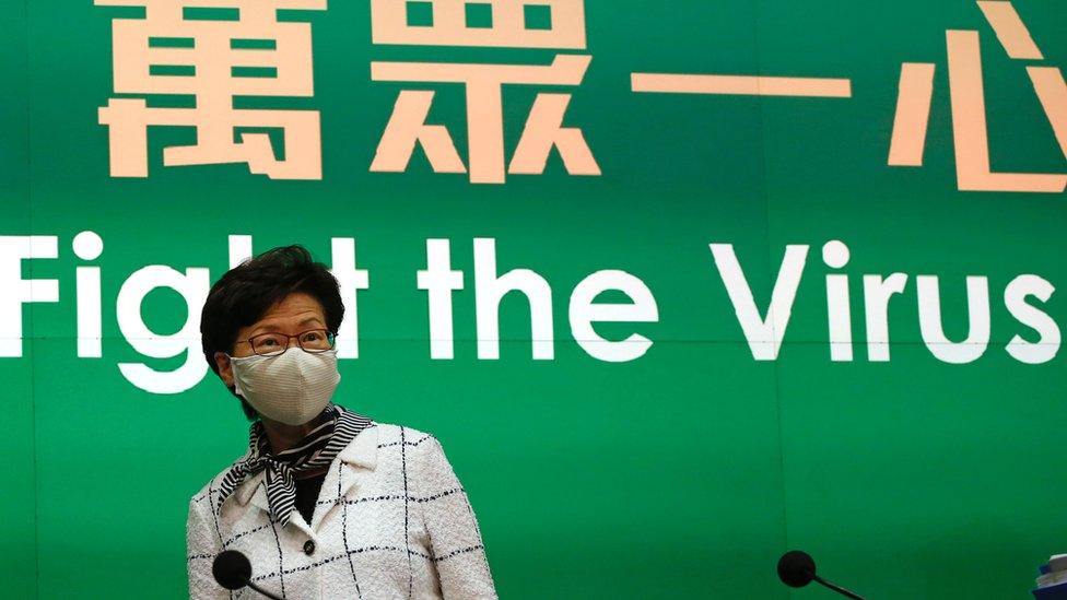 Carrie Lam wearing a face mask at a ress conference