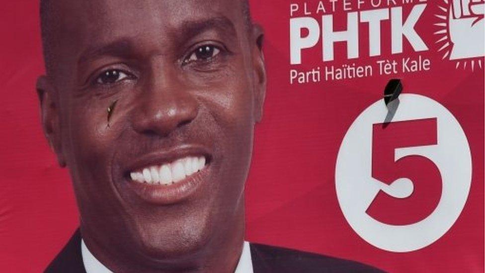 An election poster of the presidential candidate Jovenel Moise in Port-au-Prince on 12 November, 2015