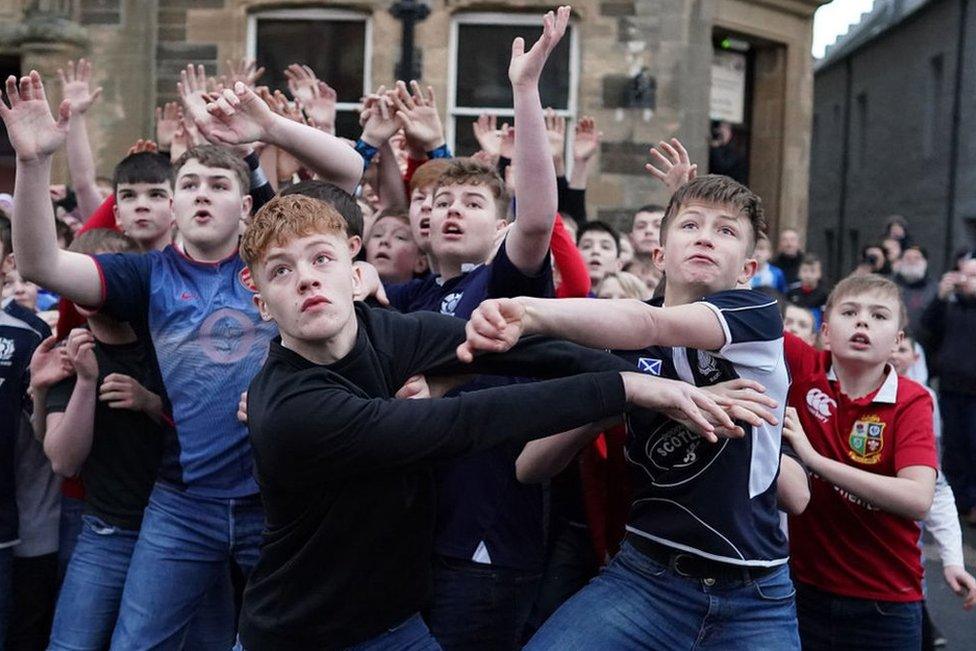 Orkadian youths take part in the Boys New Year's Ba' Game played with a hand crafted leather ball on 1 January 2020 in Kirkwall Scotland.