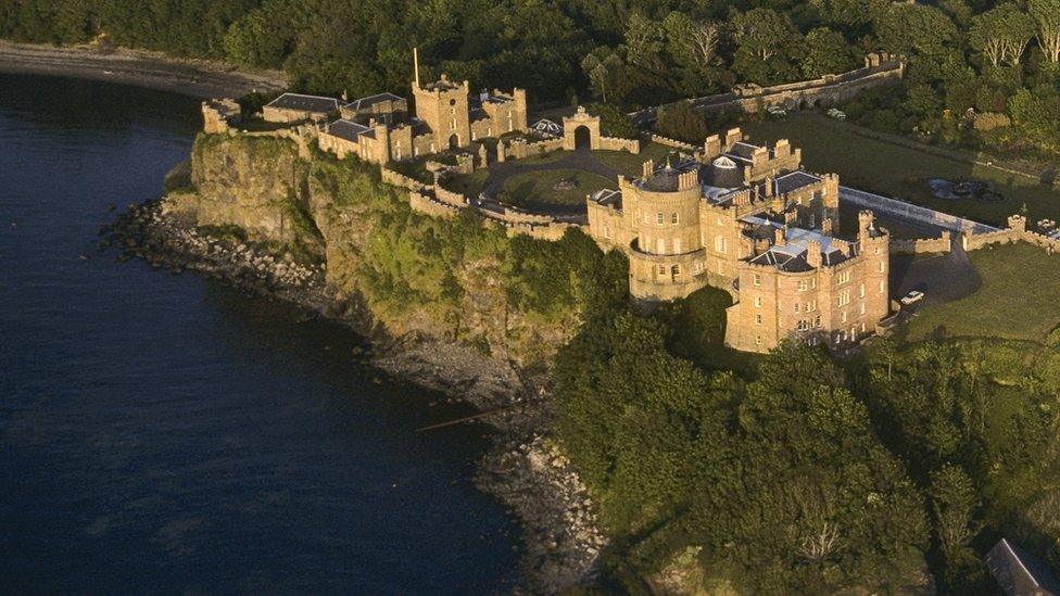 The caves are in the cliffs beneath the castle