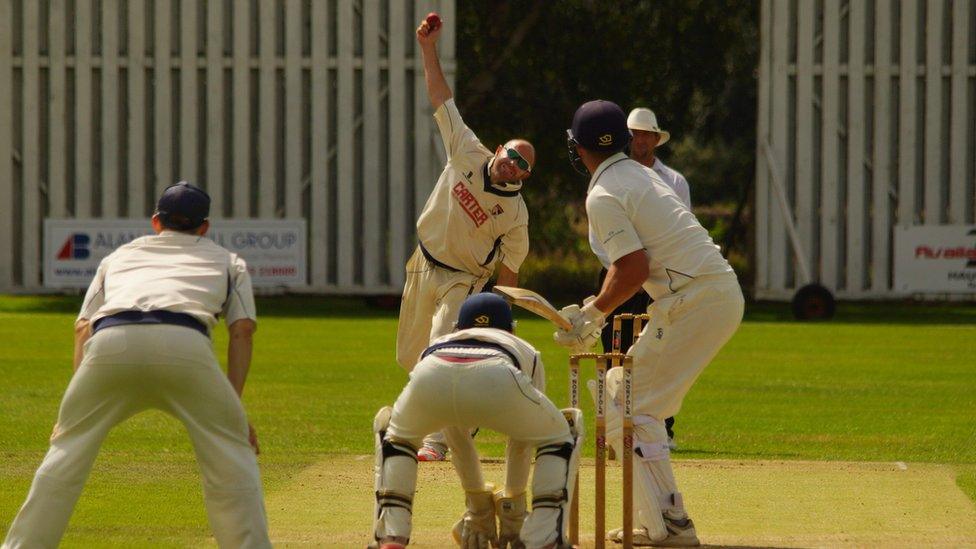 Chris Brown bowling for Norfolk CC