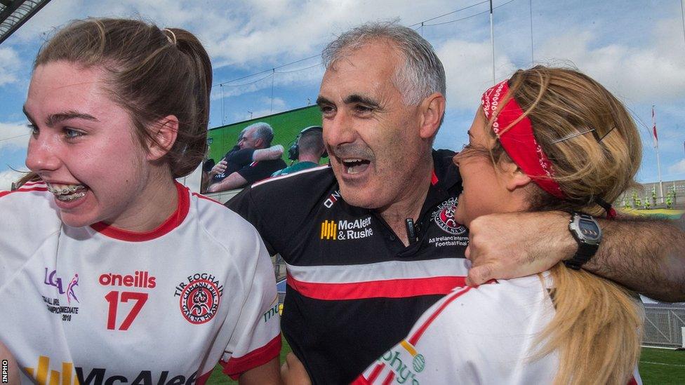 Manager of the Tyrone team, Gerry Moane, celebrates with Maria Canavan and Lycrecia Quinn after the game