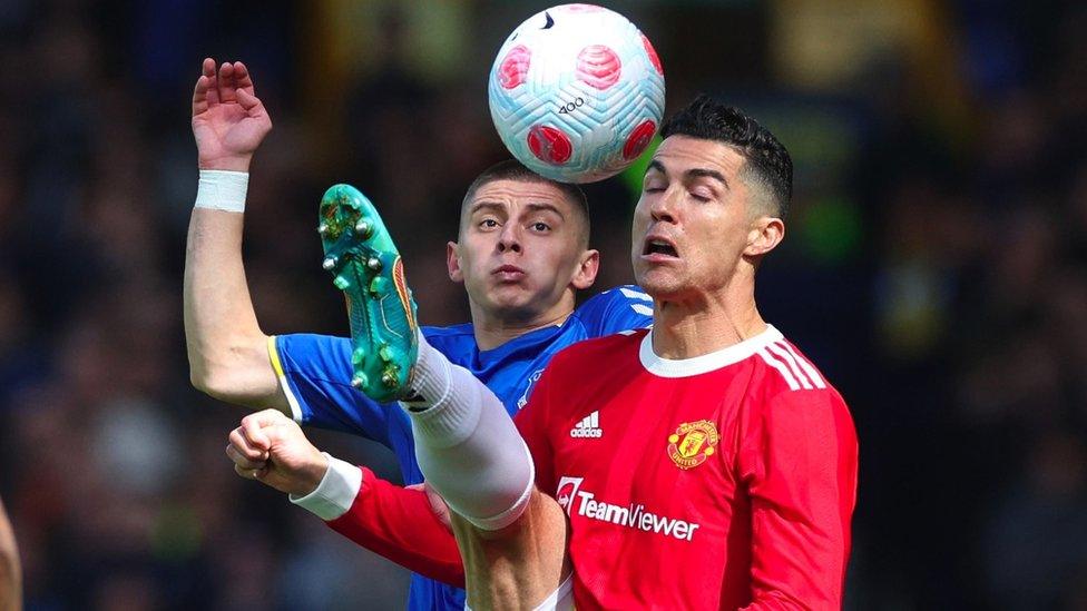 Manchester United's Cristiano Ronaldo in action with Evertons Vitaliy Mykolenko in the Premier League