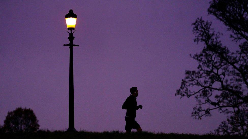 Man jogging at sunset