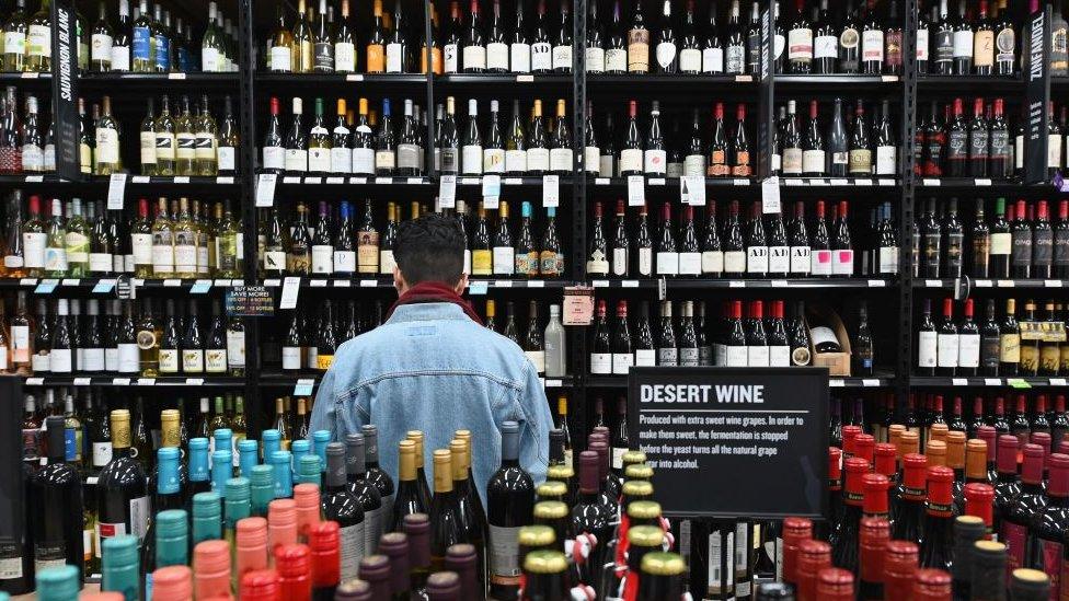 A man in a wine shop