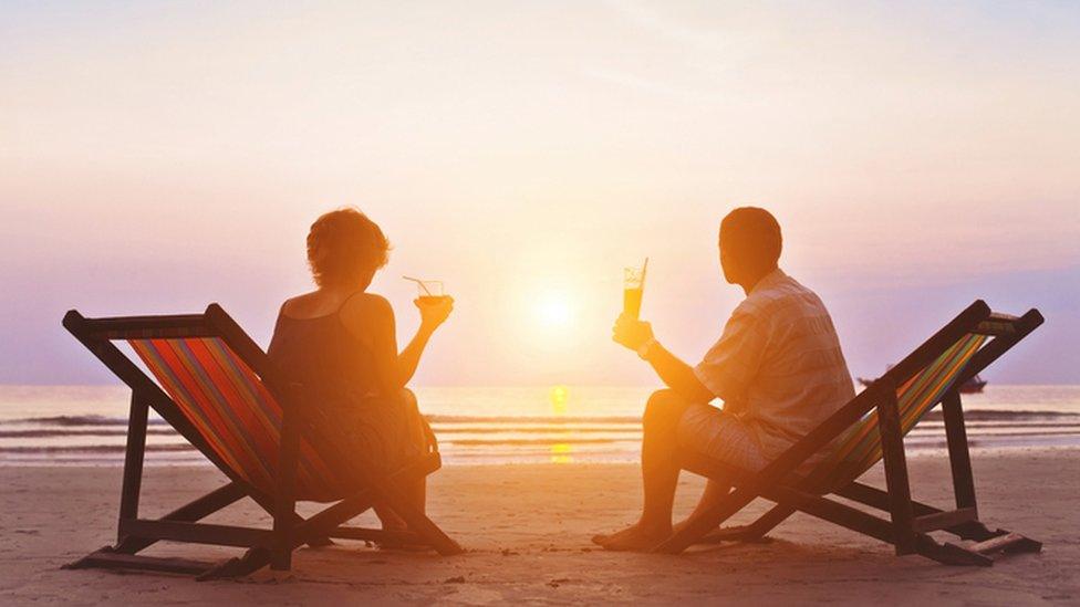 Couple on beach in sun