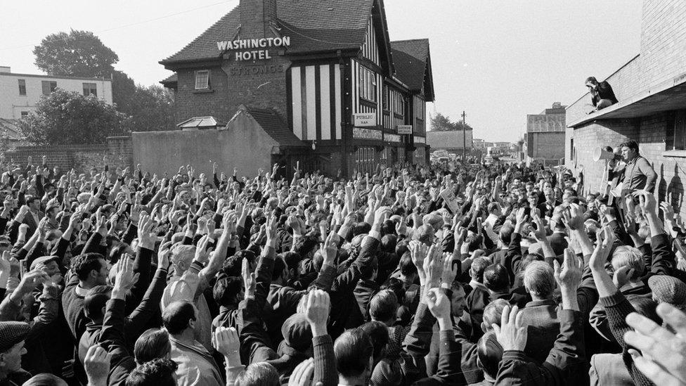 Union leaders ask for a show of hands during a meeting in support of striking British Leyland Motor Group workers, 31 July 1970