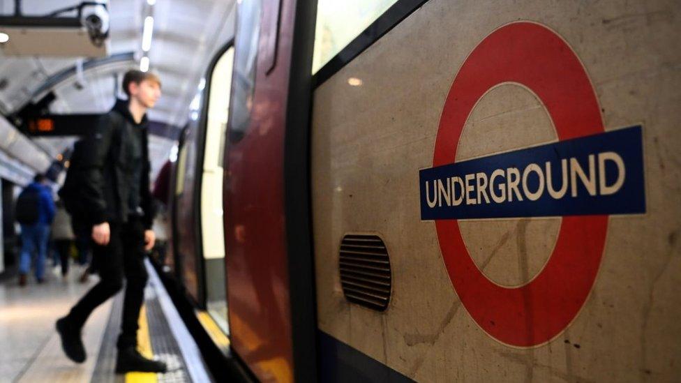 File image showing man boarding a Tube carriage