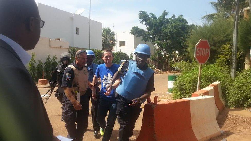 People being evacuated from Radisson Blu Hotel hotel in Bamako, Mali, Friday Nov. 20, 2015.