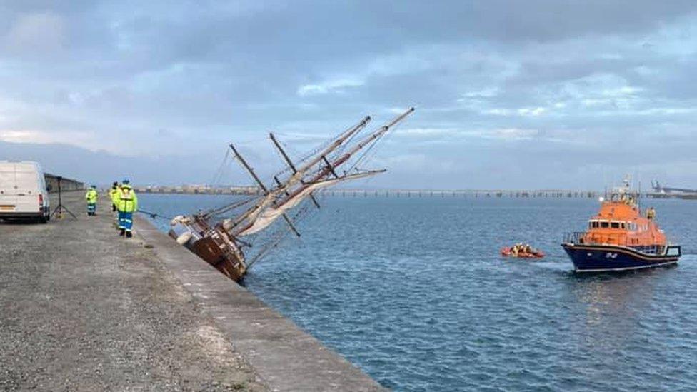 Zebu at a 45 degree angle with coastguard vessel