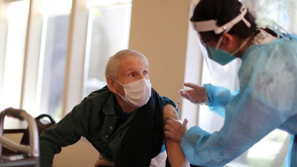 Donald Caster, 88, receives the coronavirus vaccine at Mission Commons assisted living community in Redlands, California