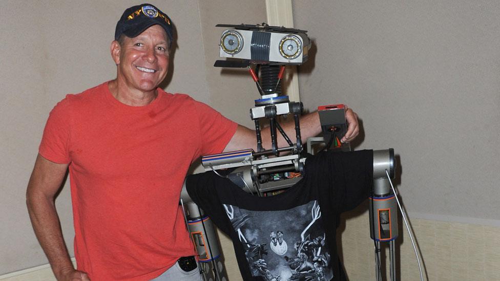 Short Circuit actor Steve Guttenberg poses with the Johnny 5 robot in 2018