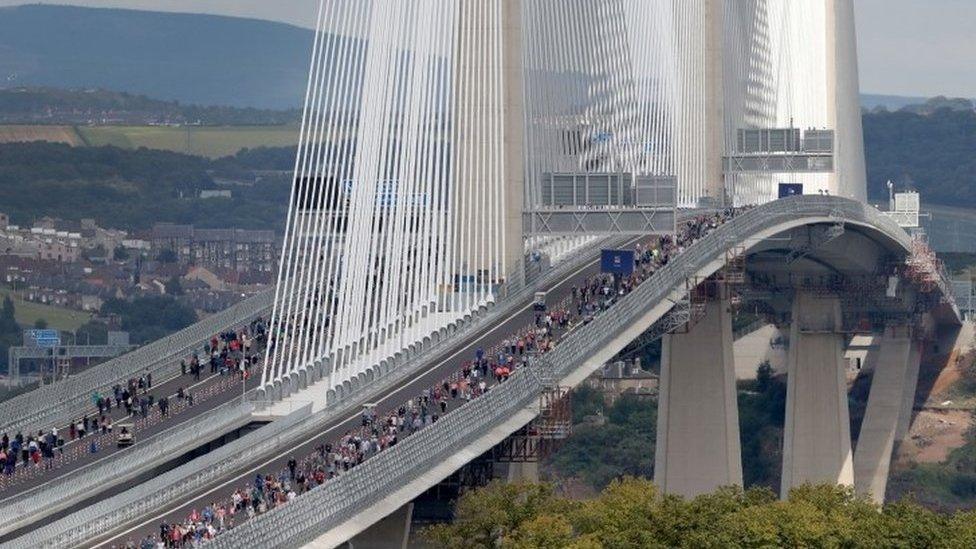 Walkers on bridge