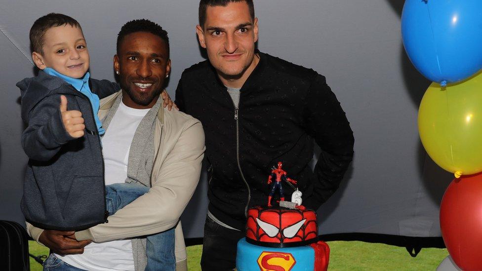 Sunderland's Jermain Defoe was joined by other players, including Vito Mannone (right).