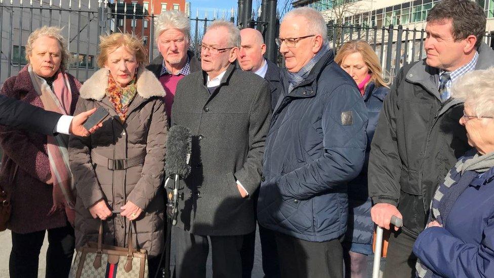 Families of Kingsmills' victims and sole survivor Alan Black (centre)