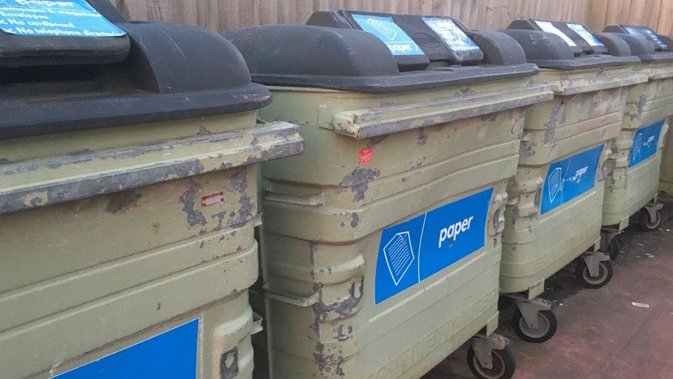 shared paper recycling bins.