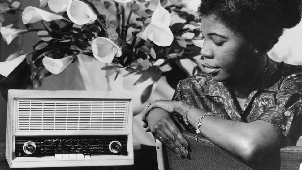 A woman listening to the BBC African Service in 1961