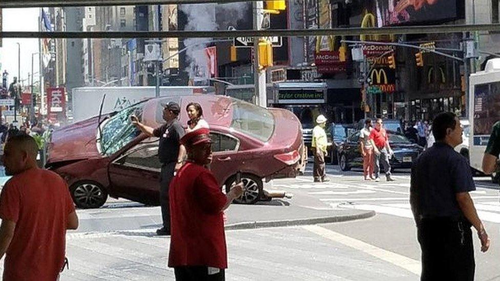 Onlookers near a deadly car crash in New York's Times Square