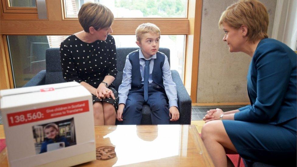 Michael Young, his mother Michelle and the first minister