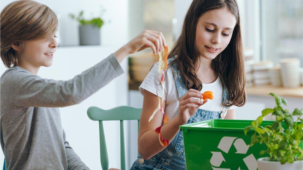 Kids recycling food waste