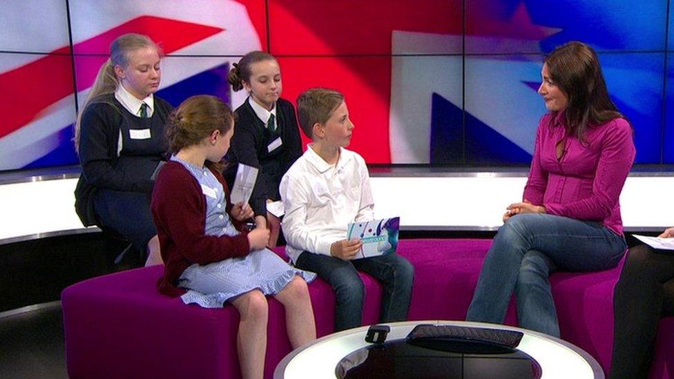 Katya Adler with children in the Newsround studio.