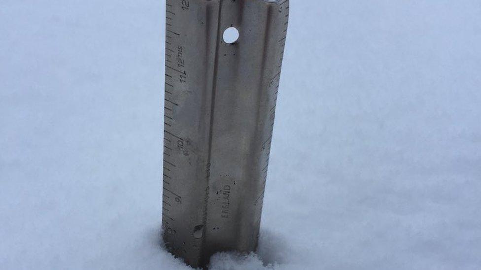 A snow stick shows 20cm of snowfall in the Brecon Beacons