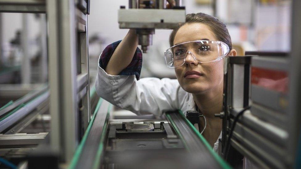 Engineer examining machine