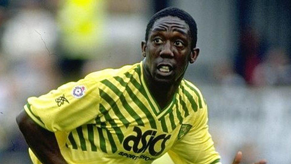 Ruel Fox in Norwich City's home kit with a yellow top and green shorts