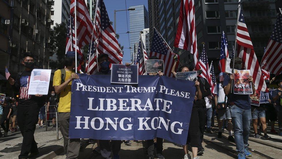 Marchers waved the Stars and Stripes flag