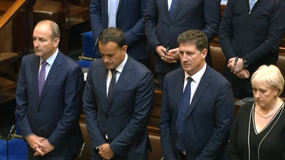 Taoiseach Micheál Martin, Tánaiste Leo Varadkar, Green Party leader Eamon Ryan and other TDs (MPs) observing the silence