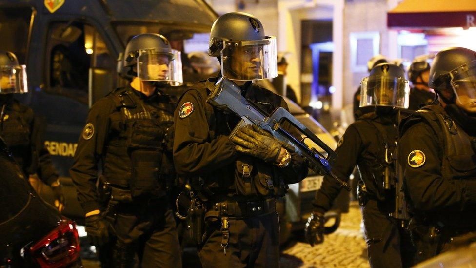 French police react after a shooting in which an officer was fatally shot along with the gunman in an attack near the Champs Elysees Paris, 20 April 2017