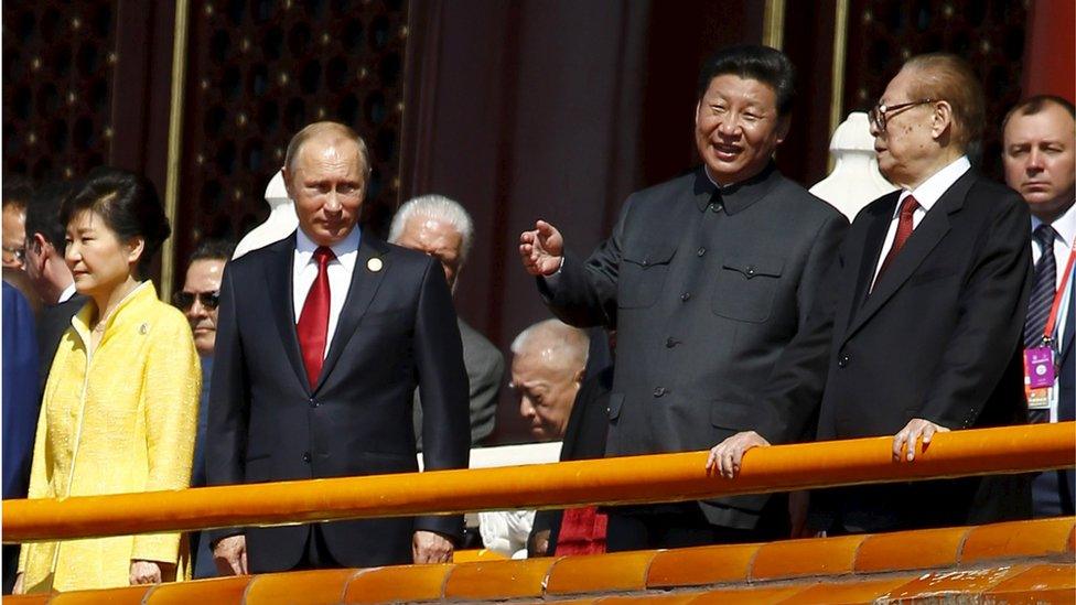 Chinese President Xi Jinping (2nd R) talks to former President Jiang Zemin (R) next to Russia's President Vladimir Putin (2nd L) and South Korea's President Park Geun-hye on the Tiananmen Gate, at the beginning of the military parade marking the 70th anniversary of the end of World War Two, in Beijing, China, 3 September 2015