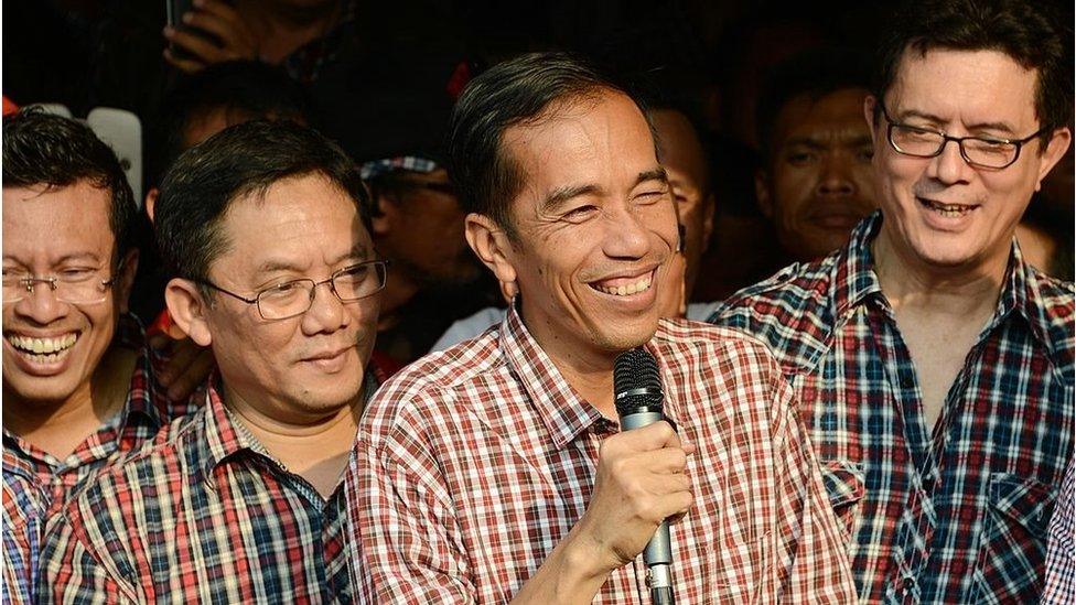 Governor elect Joko Widodo (centre, with microphone) delivers a speech in Jakarta on September 20, 2012.