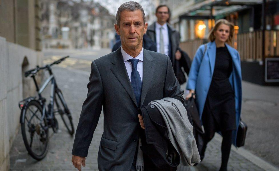 French-Israeli diamond magnate Beny Steinmetz (L) arrives with his lawyers at his trial over alleged corruption linked to mining deals in Guinea on January 11, 2021 in Geneva