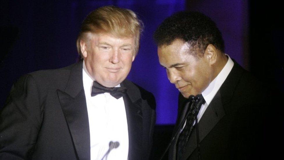 Donald Trump (left) accepts his Muhammad Ali award from Ali at Muhammad Ali's Celebrity Fight Night XIII in Phoenix, Arizona (March 2007)