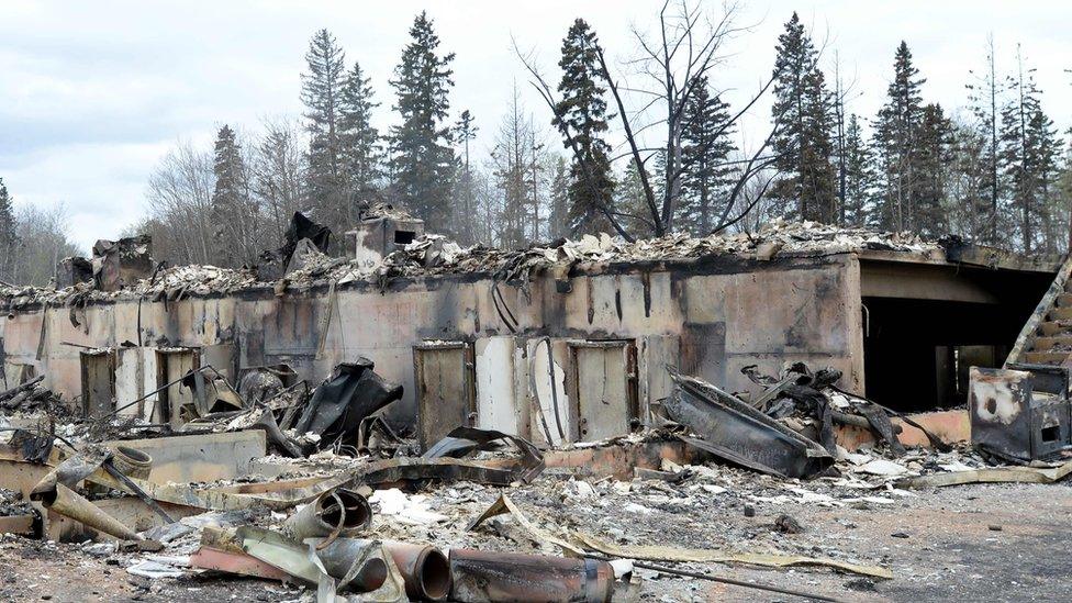 A burnt-out shell of a building in Fort McMurray, Alberta, 9 May