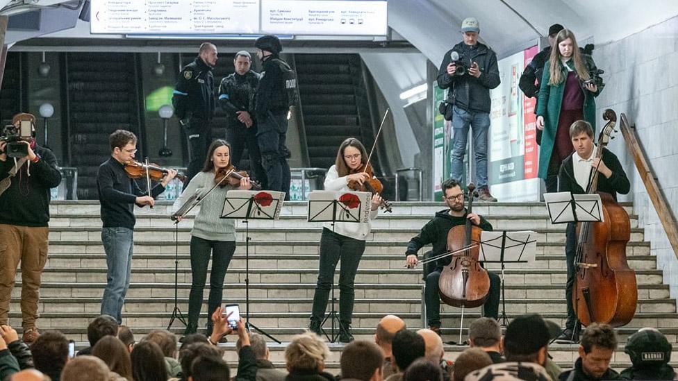 String musicians performing in Kharkiv Metro Station