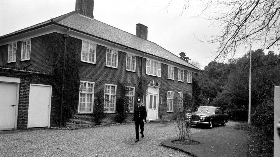 House with policeman in front