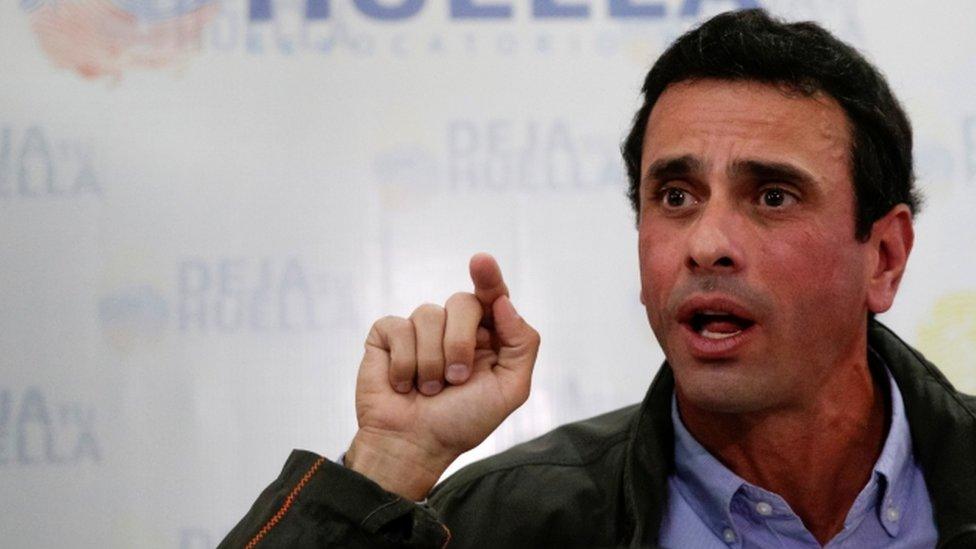 Venezuelan opposition leader and Governor of Miranda state Henrique Capriles speaks during a news conference in Caracas