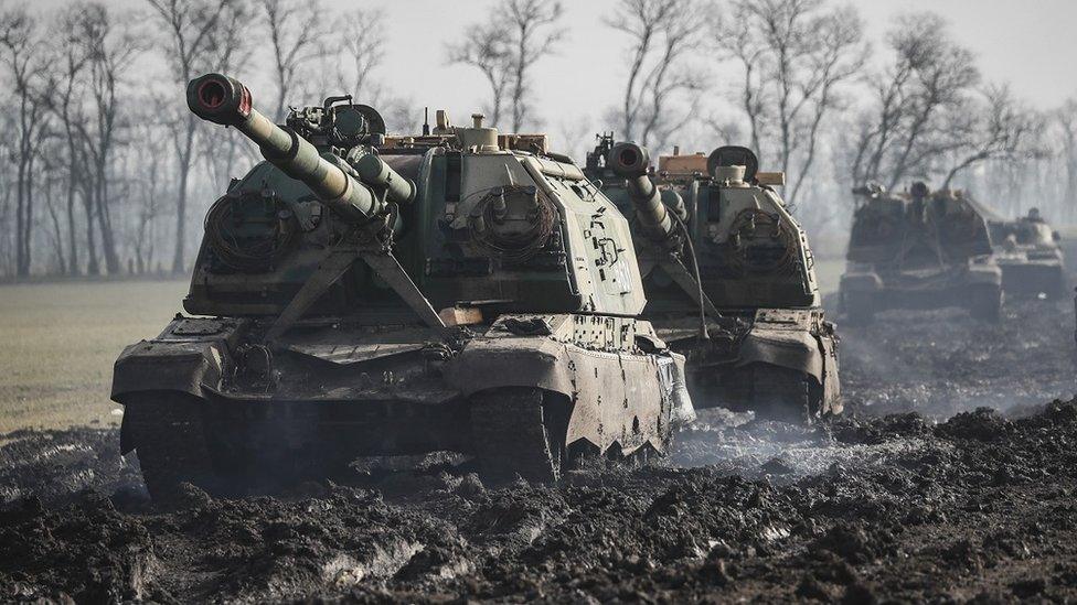 Russian armoured vehicles stand on the road in Rostov region, Russia