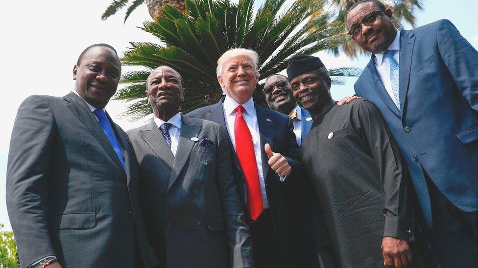 Donald Trump posing with African leaders in Italy