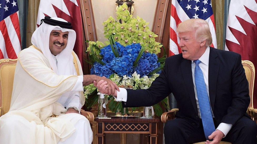 This file photo taken on May 21, 2017 shows US President Donald Trump (R) shaking hands with Qatar's Emir Sheikh Tamim Bin Hamad Al-Thani, during a bilateral meeting at a hotel in the Saudi capital Riyadh