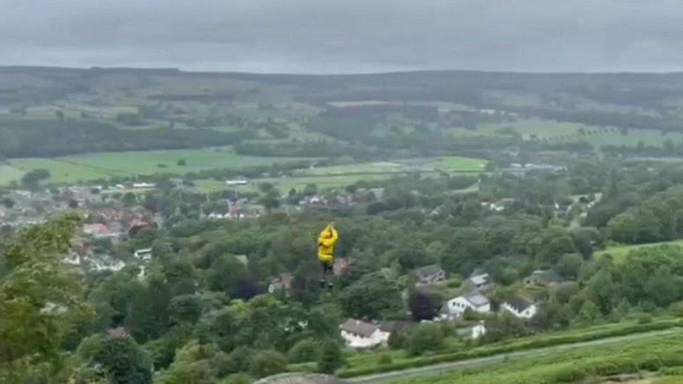 Person riding zipwire