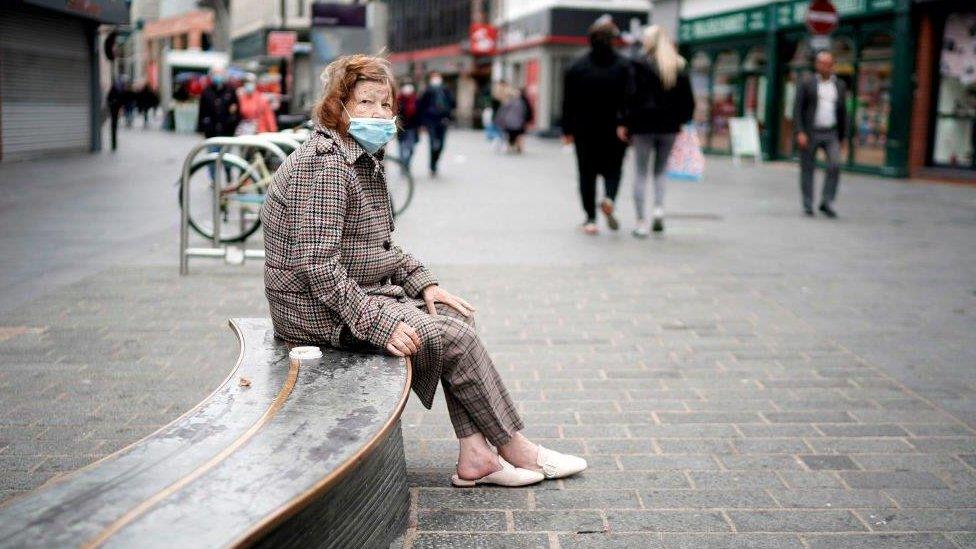 Woman wearing face mask in Liverpool