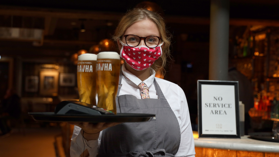 Waitress serving pints